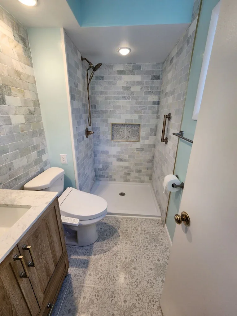 Remodeled bathroom with tiled walk-in shower