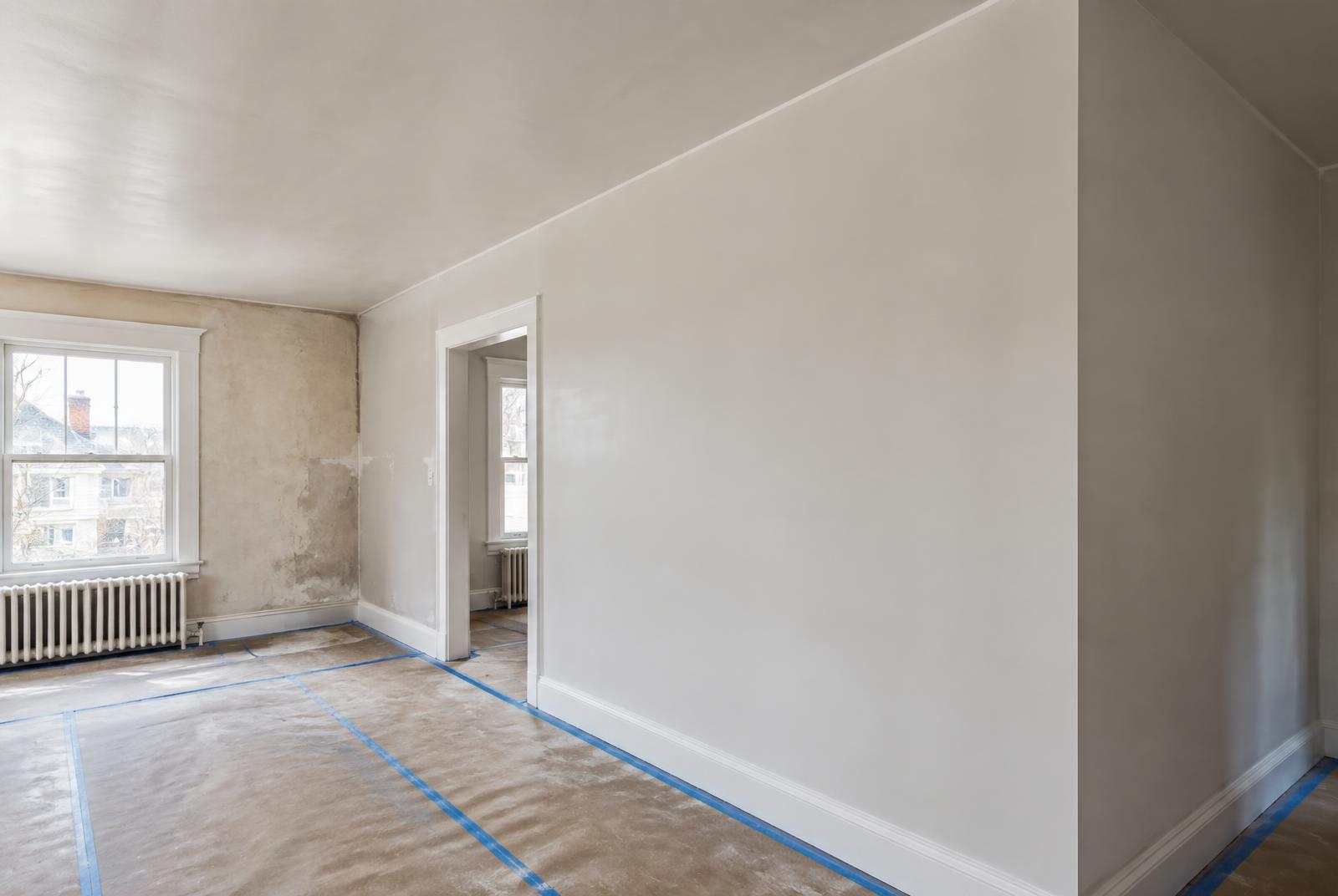 Smooth drywall and plaster repair prepared for paint in an older home